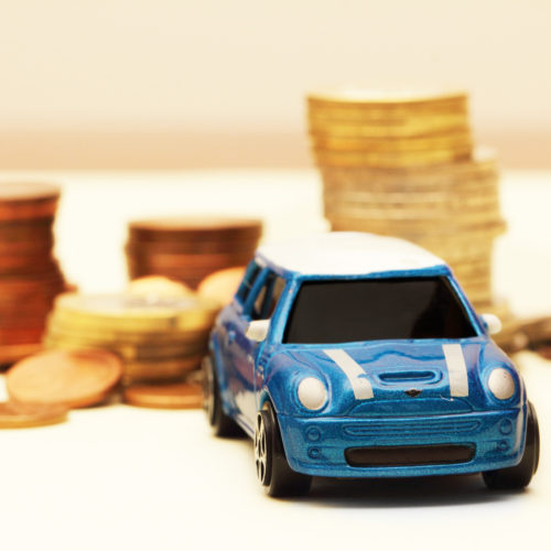 stacked coins and toy car